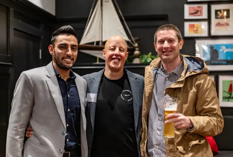 Leo with attendees at an industry networking event