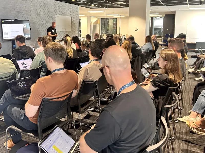 Leo running a hands-on AI workshop for a finance team in Auckland