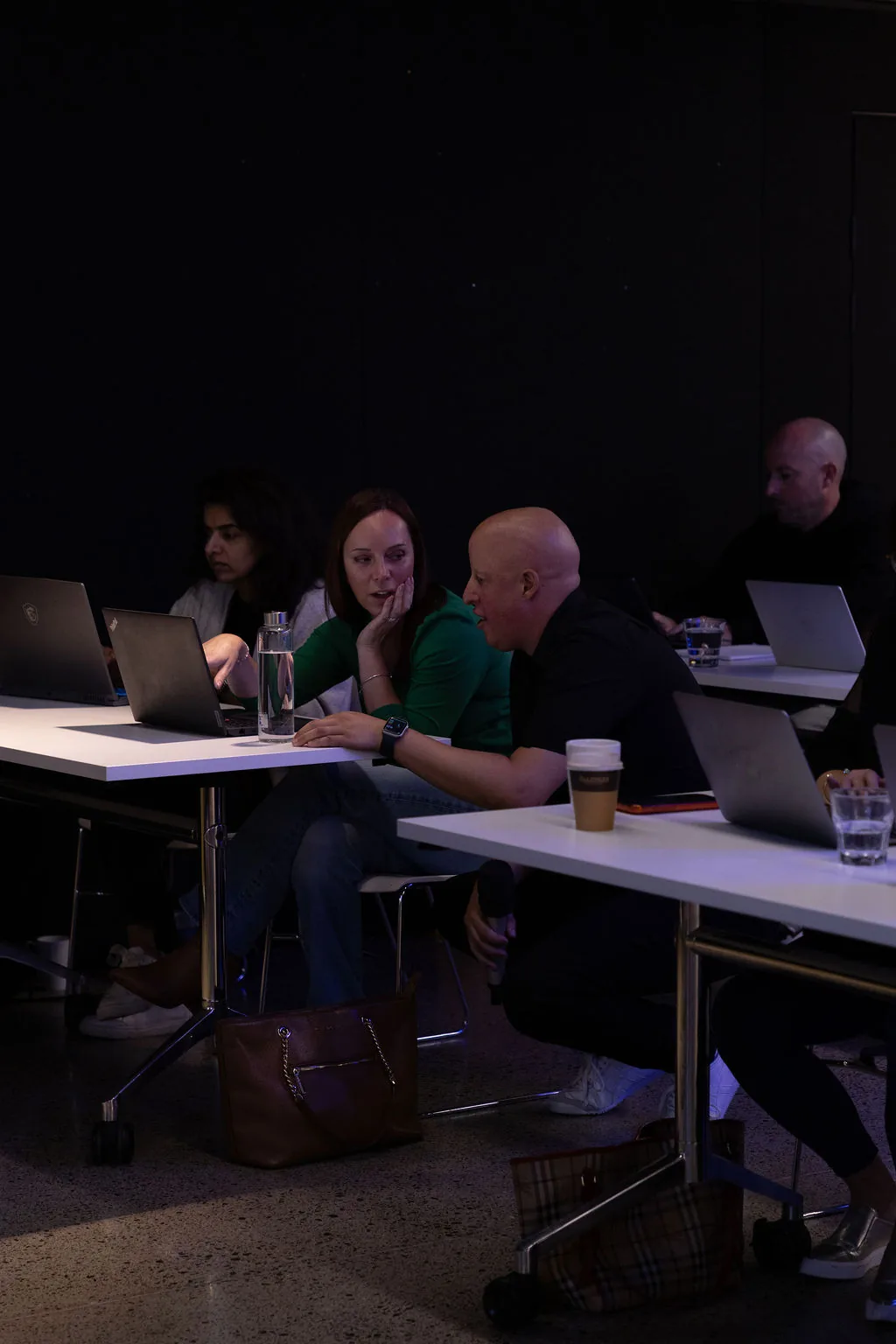 Attendees collaborating on AI projects